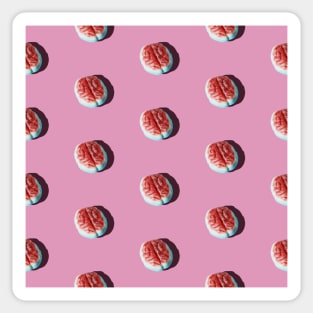 Halloween brain candy arranged in a pattern on a pink background. Sticker